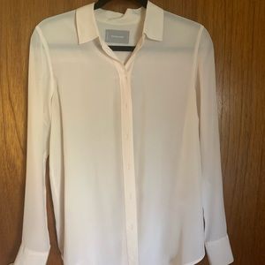 Everlane long sleeve silk blouse in pale pink. White silk shown for contrast.